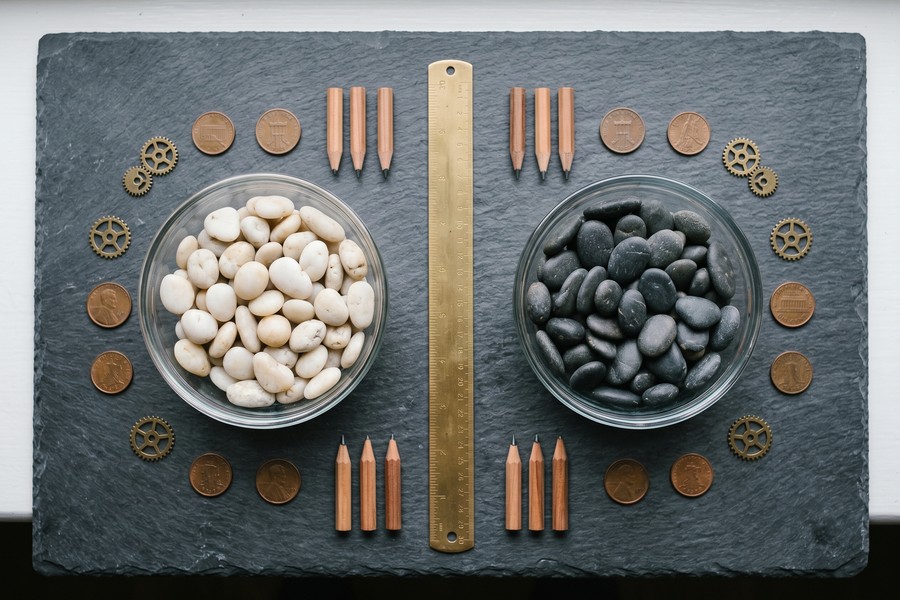 Comparison graphic showing HubSpot CRM and Zoho CRM dashboards side by side on desktop