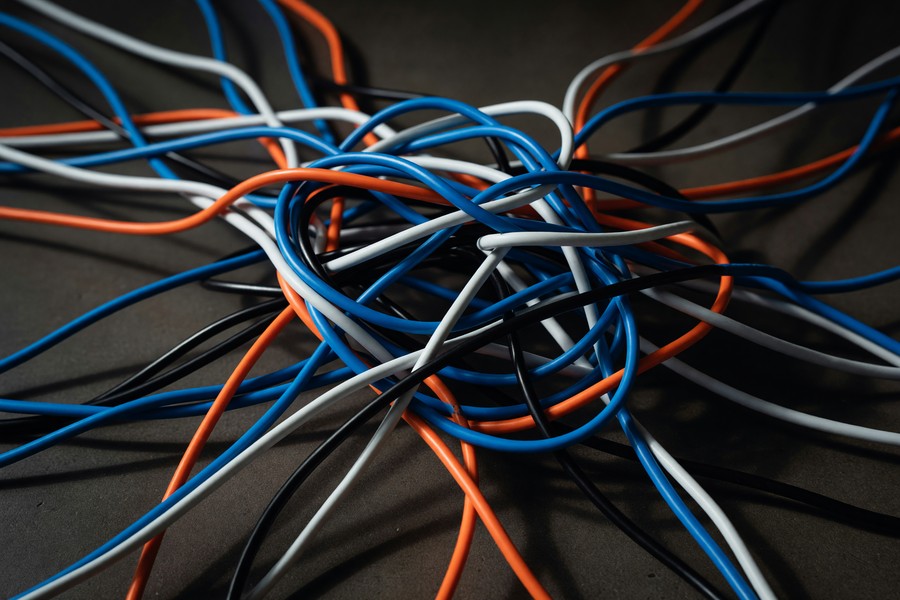 Smart home dashboard app showing lights, thermostat, and camera controls on a smartphone