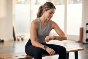 Smartwatch vs fitness tracker side by side comparison on a wrist