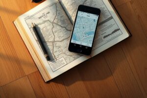 A smartphone showing GPSmyCity and Wanderlog apps with travel maps and itinerary planning interface