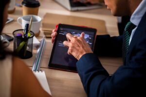 Law firm associate reviewing contracts on screen with AI automation software