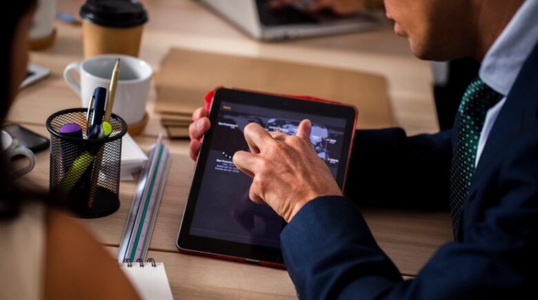 Law firm associate reviewing contracts on screen with AI automation software