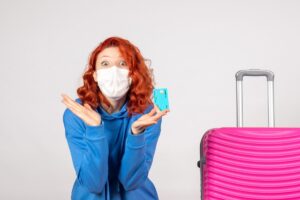 A traveler refilling a foldable water bottle after passing through airport security