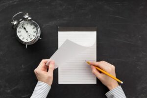 Austin freelance writer using AI writing tools to generate first draft on laptop