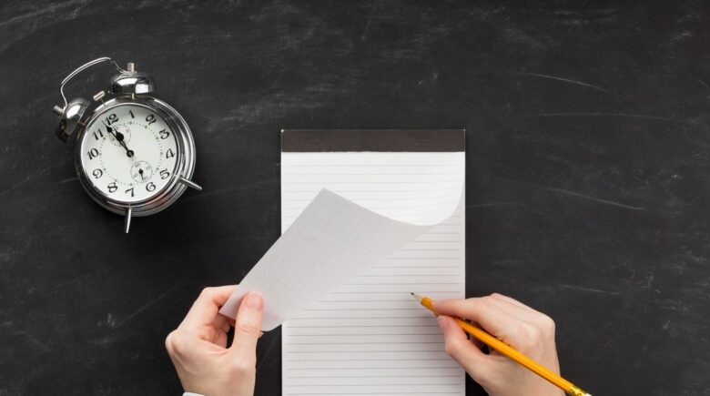Austin freelance writer using AI writing tools to generate first draft on laptop