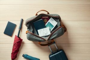 Traveler weighing carry-on bag at airport using scale app on phone