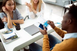 A traveler using a bank's travel portal to book a flight with AI price predictions and rewards