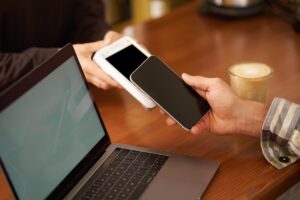 A portable power bank charging three devices simultaneously with a travel setup
