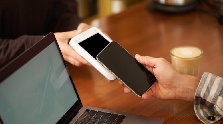 A portable power bank charging three devices simultaneously with a travel setup