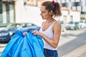 Reusable dry bag storing wet clothes in a car trunk