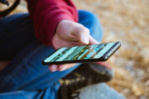 A traveler using a travel insurance app in a remote location with no internet signal