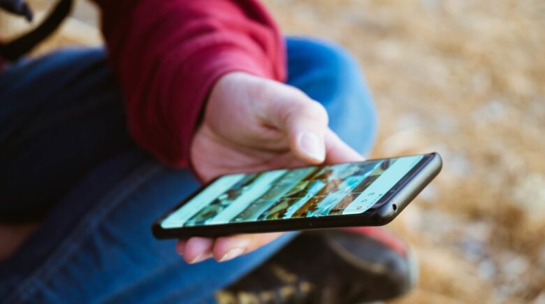 A traveler using a travel insurance app in a remote location with no internet signal
