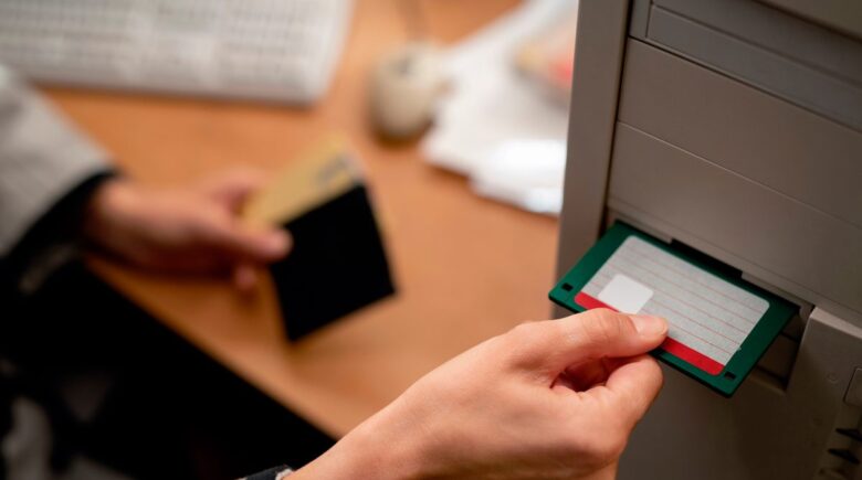 A traveler using a RFID-blocking travel wallet to secure cash and cards