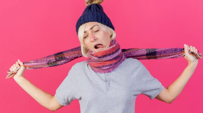 Folded recycled polyester and merino wool multi-use scarf next to items it replaces: pillow, blanket, towel, and clothing layers