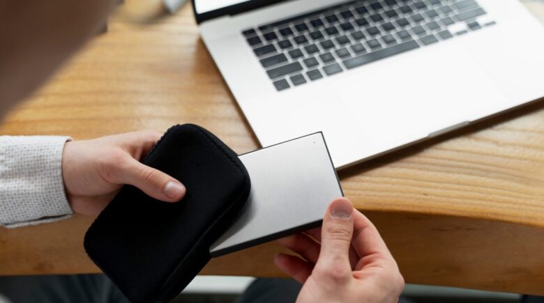 A phone credit card case holding a phone, credit card, and ID with a sleek, modern design