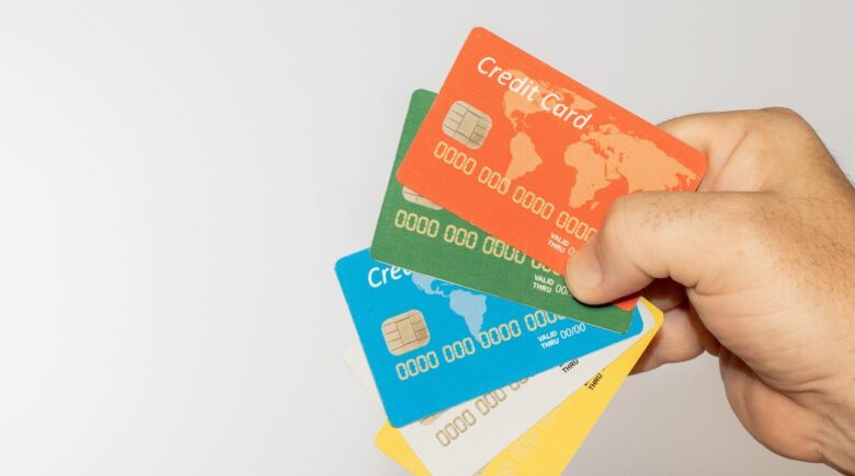 Traveler using a multi-currency travel card across three countries