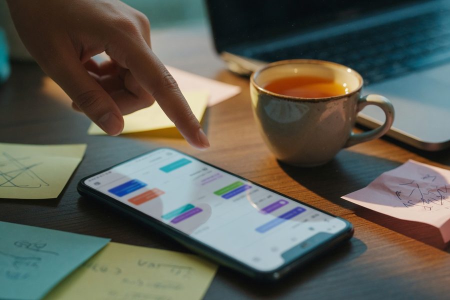Four browser tabs showing native platform schedulers side by side