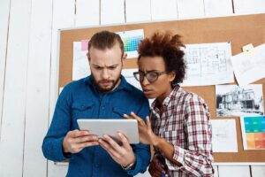 Side-by-side comparison of Trello and ClickUp interfaces for managing multiple freelance clients