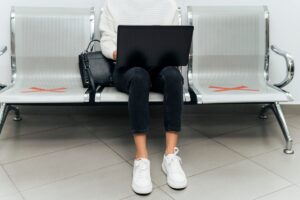 Passenger checking seat number on aircraft boarding gate