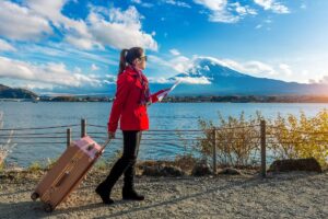 A traveler using a smartphone to book Japan trips without a travel agency