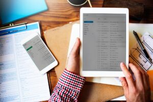 Solo lawyer at desk reviewing automated document workflow process on computer screen
