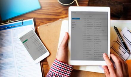 Solo lawyer at desk reviewing automated document workflow process on computer screen