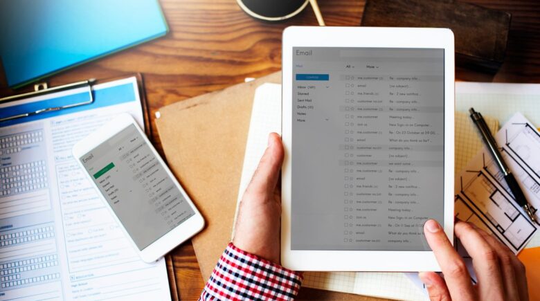 Solo lawyer at desk reviewing automated document workflow process on computer screen
